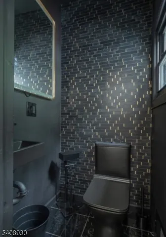 a bathroom with a shower and a sink