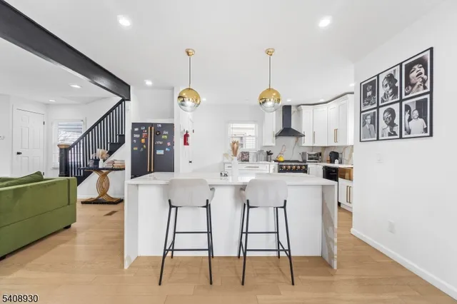 a kitchen with stainless steel appliances granite countertop a stove and a sink