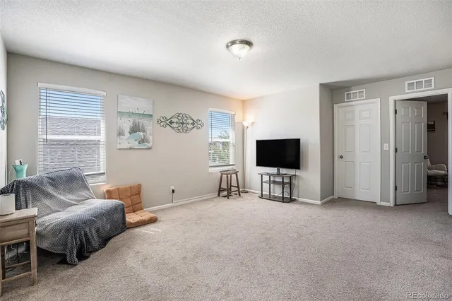 a view of livingroom with furniture and windows