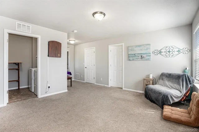 a bathroom with a glass shower door and a mirror