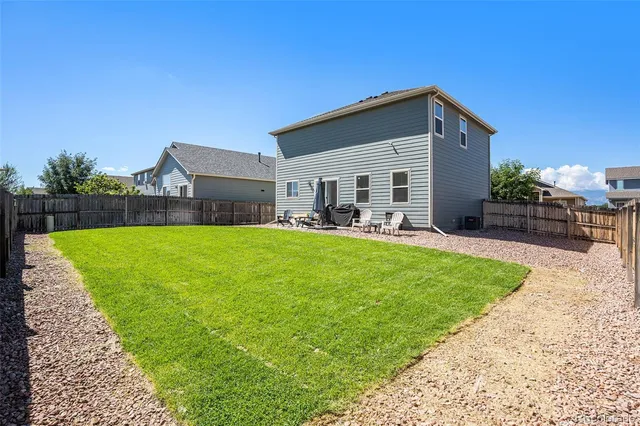 an aerial view of a house with a ocean view