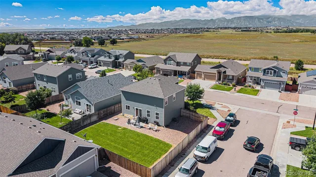 a view of a livingroom with furniture and a flat screen tv