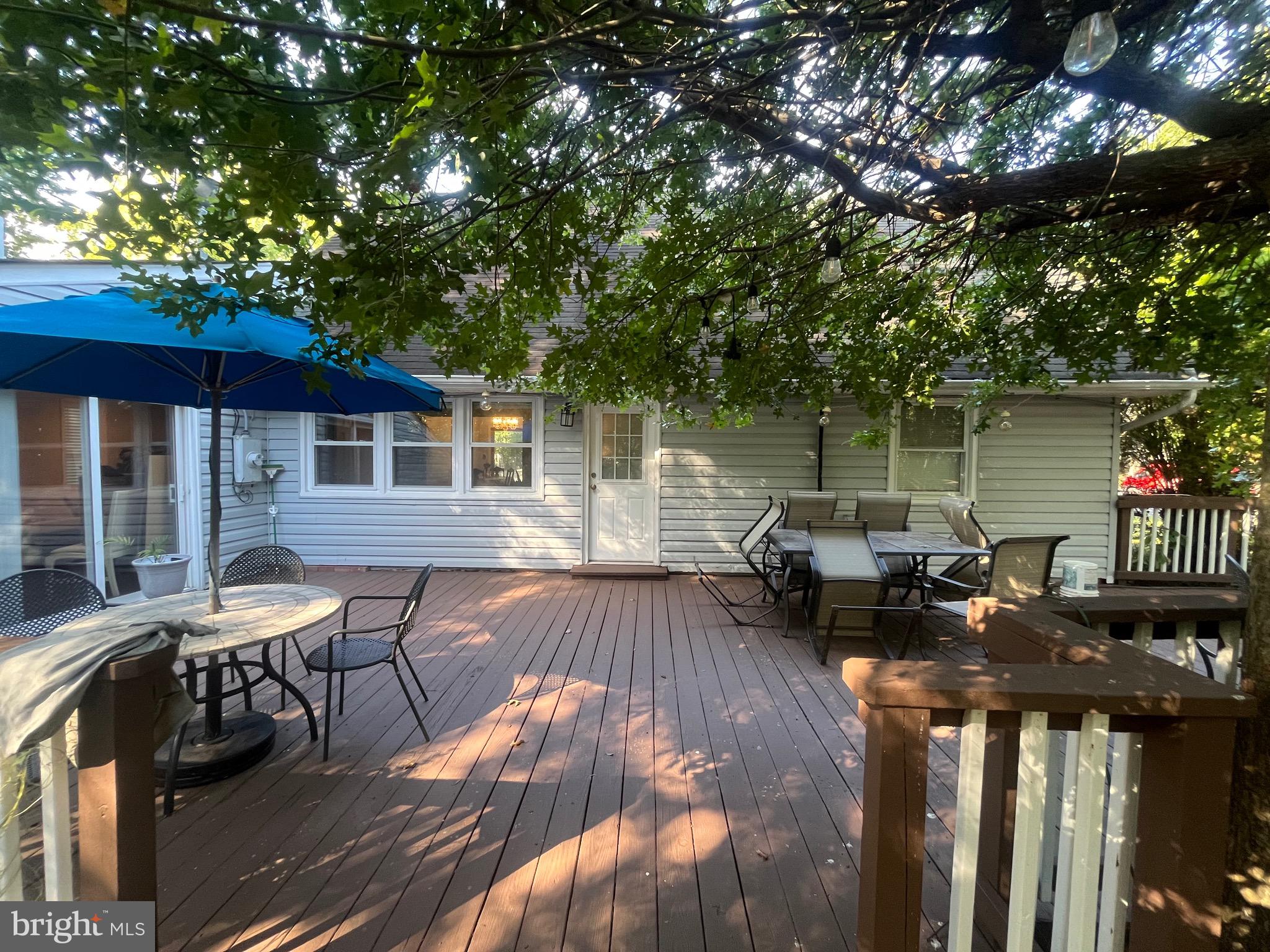 8139 Keeler Street Alexandria, VA 22309 - Photo 14 of 49 a view of a house with pool and chairs on wooden deck