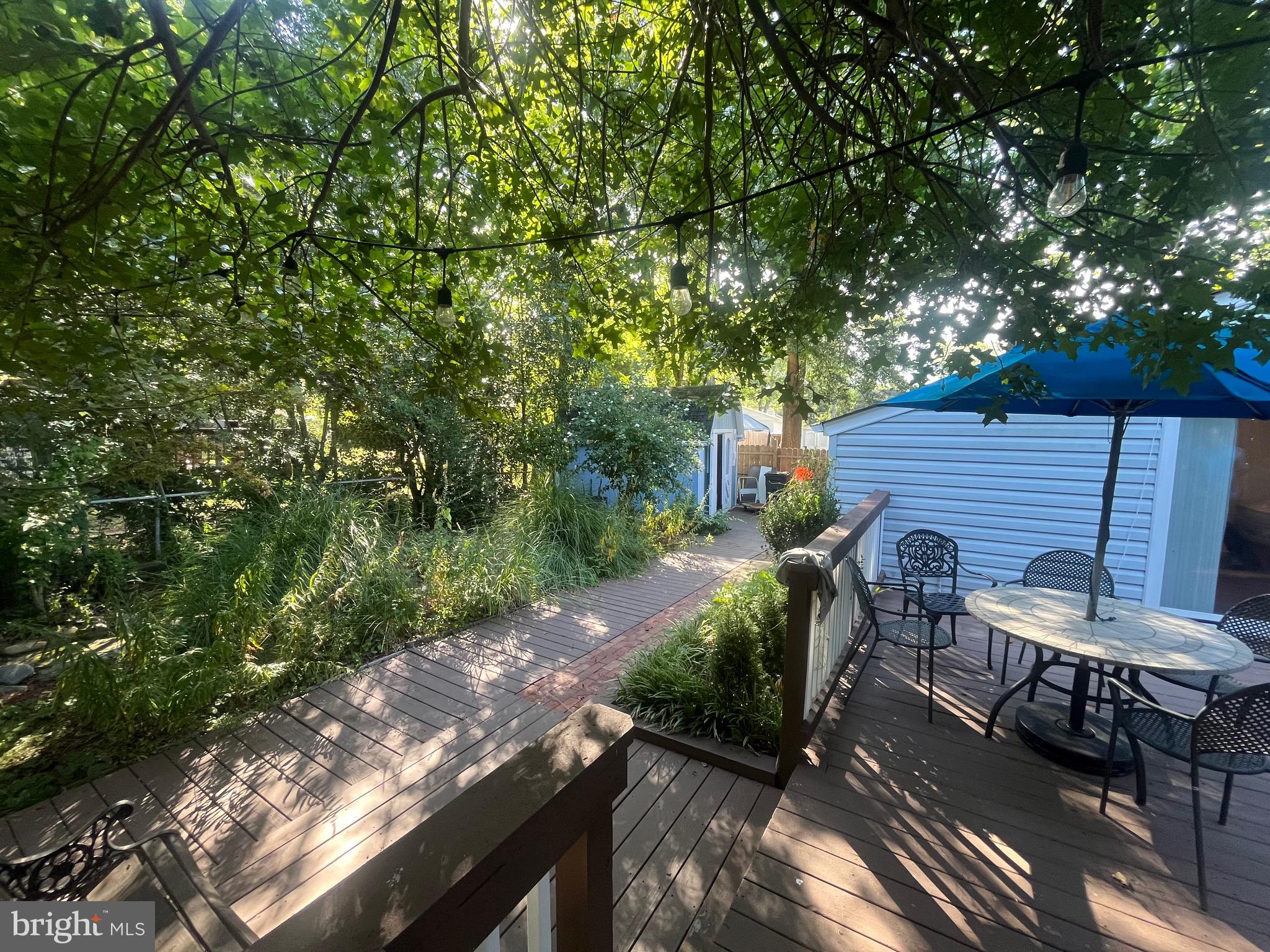 8139 Keeler Street Alexandria, VA 22309 - Photo 16 of 49 a view of backyard with outdoor seating and green space