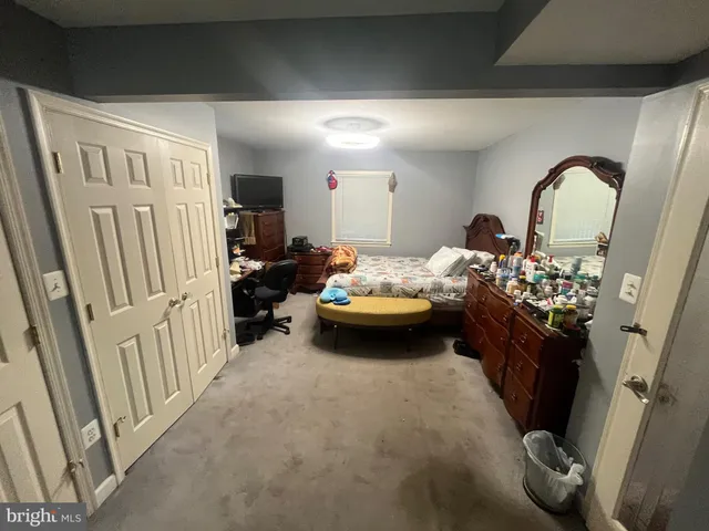 a bedroom with furniture and a couch