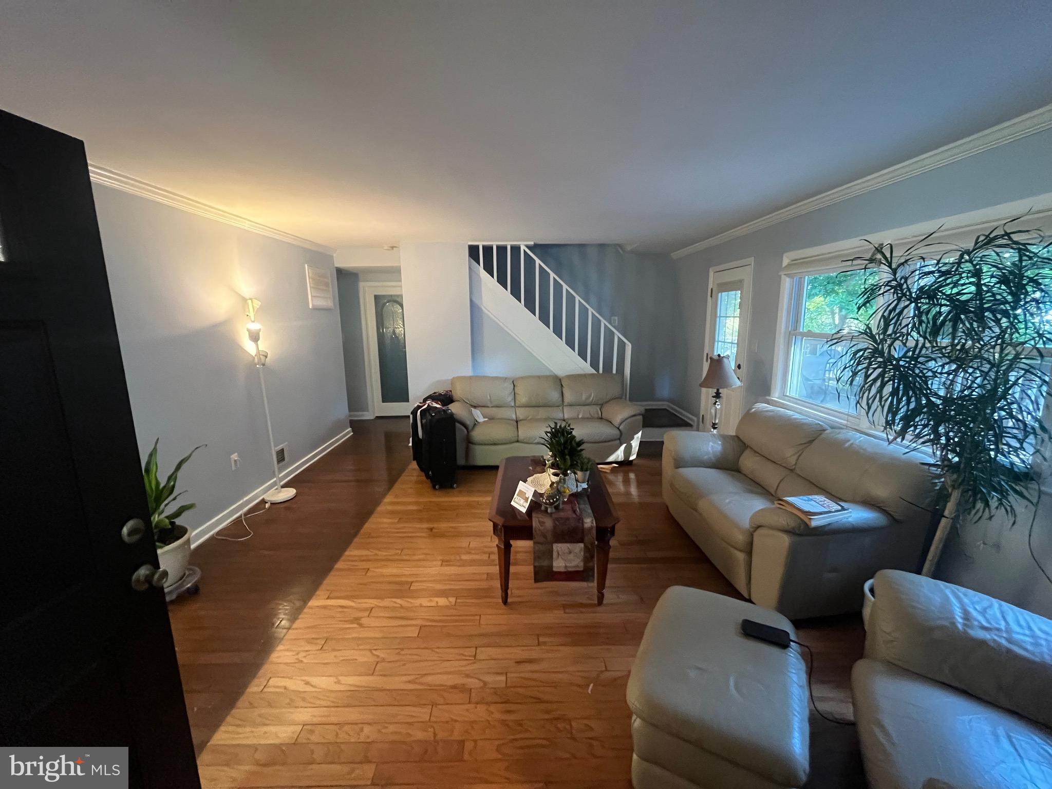 8139 Keeler Street Alexandria, VA 22309 - Photo 35 of 49 a living room with furniture and a wooden floor