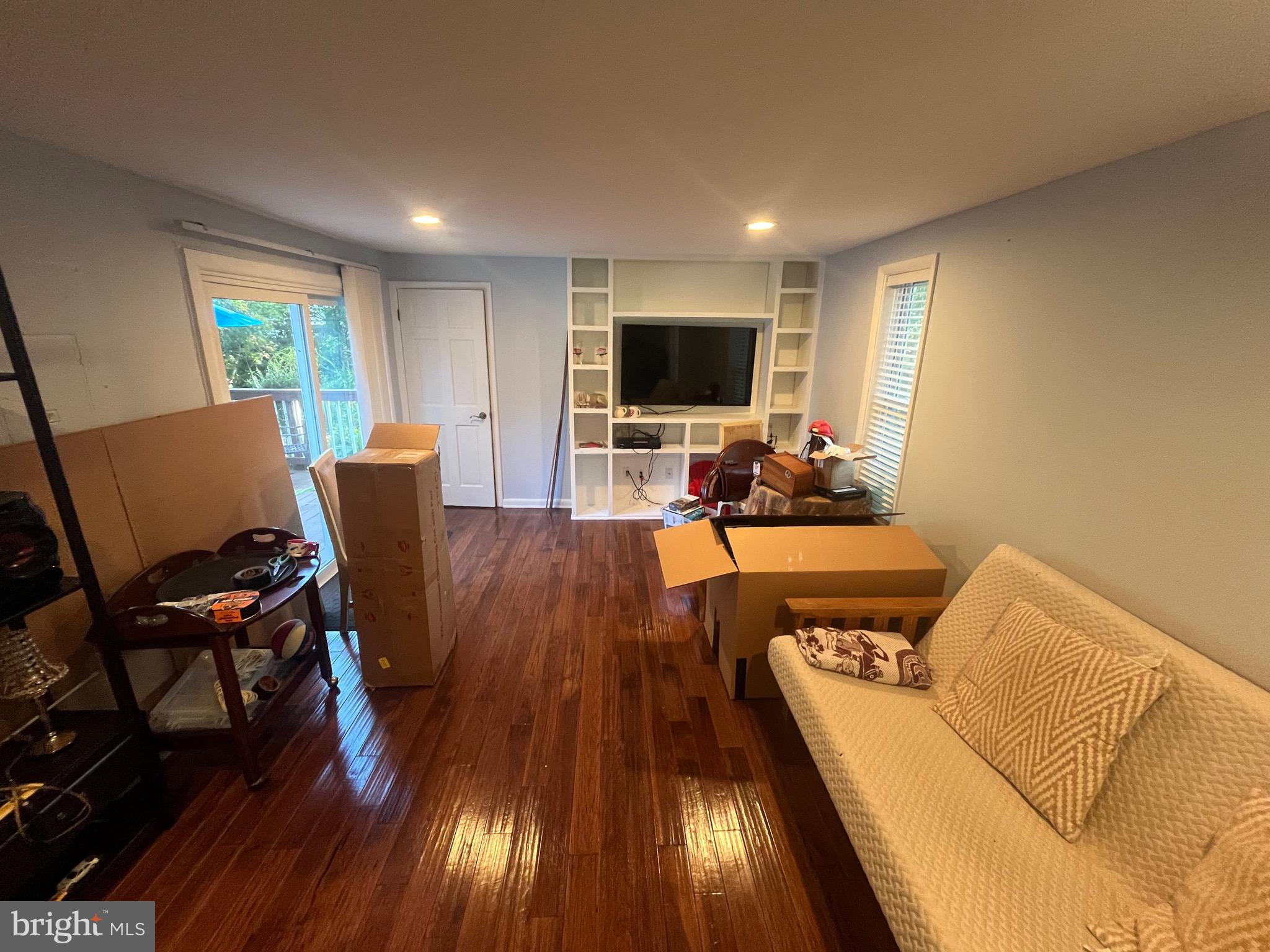 8139 Keeler Street Alexandria, VA 22309 - Photo 4 of 49 a living room with furniture and a flat screen tv