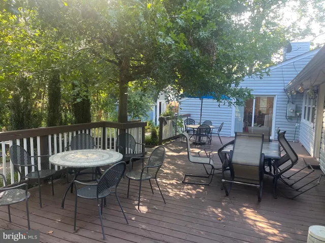 a view of a patio with two chairs and a table