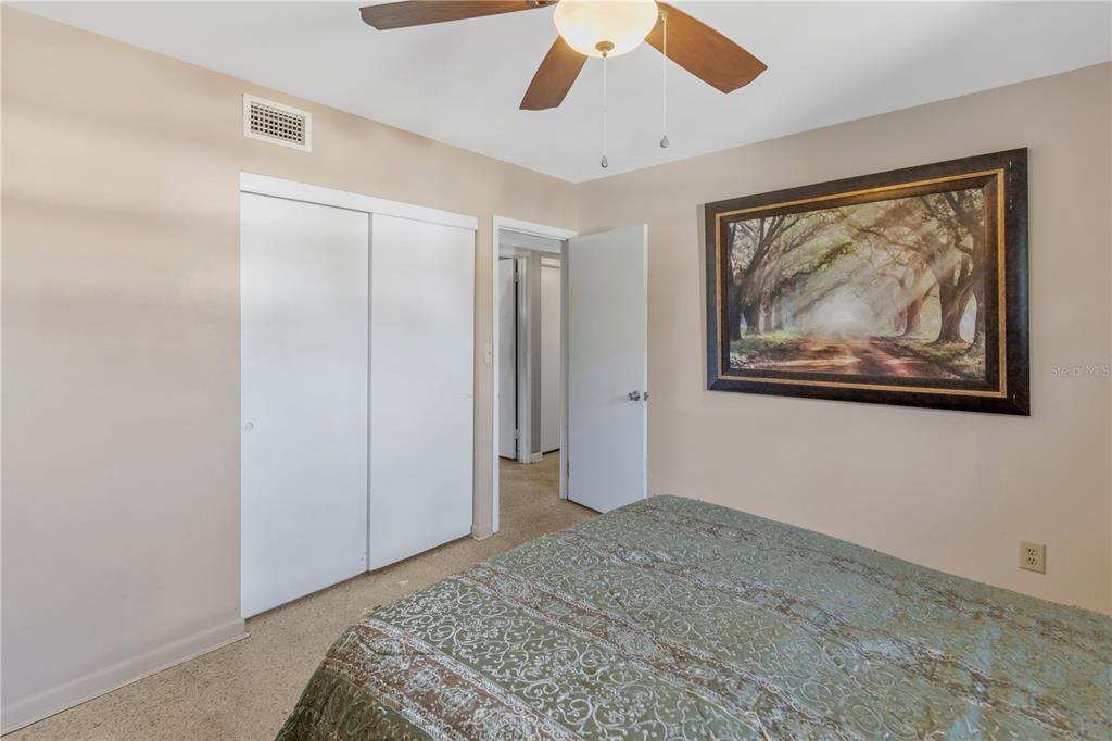 310 Kenmore Road Brandon, FL 33511 - Photo 15 of 33 a bedroom with a bed and a painting on the wall