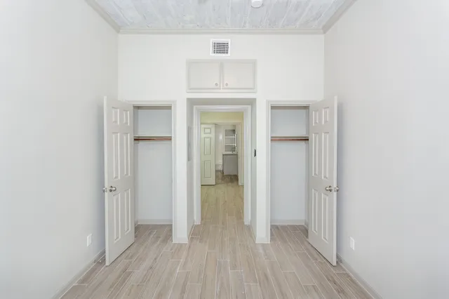 a kitchen with granite countertop a refrigerator stove and sink