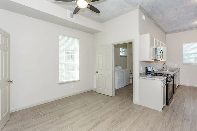 a utility room with a sink washer and dryer