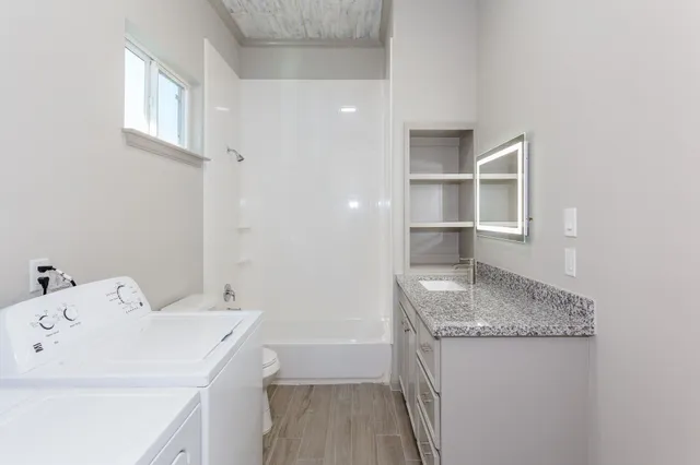 a utility room with dryer and washer