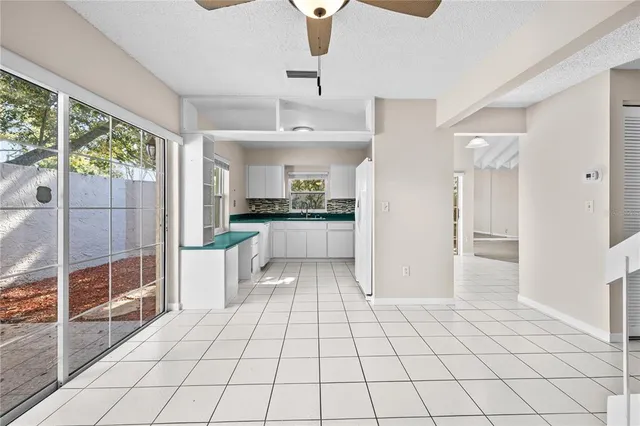 a kitchen with stainless steel appliances a refrigerator and a stove top oven
