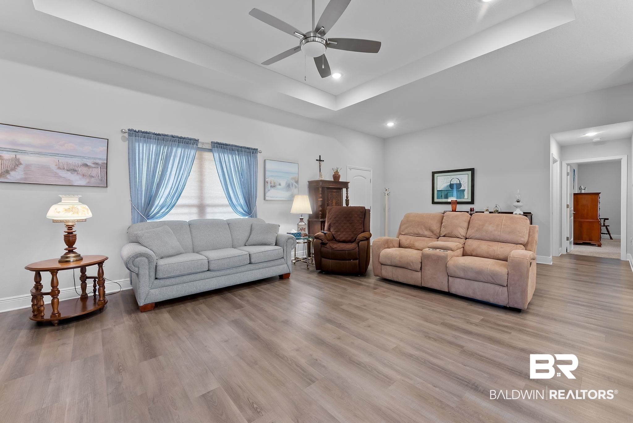32868 Arbor Ridge Circle Lillian, AL 36549 - Photo 6 of 35 Living room with a raised ceiling, light wood-style flooring, a ceiling fan, and recessed lighting
