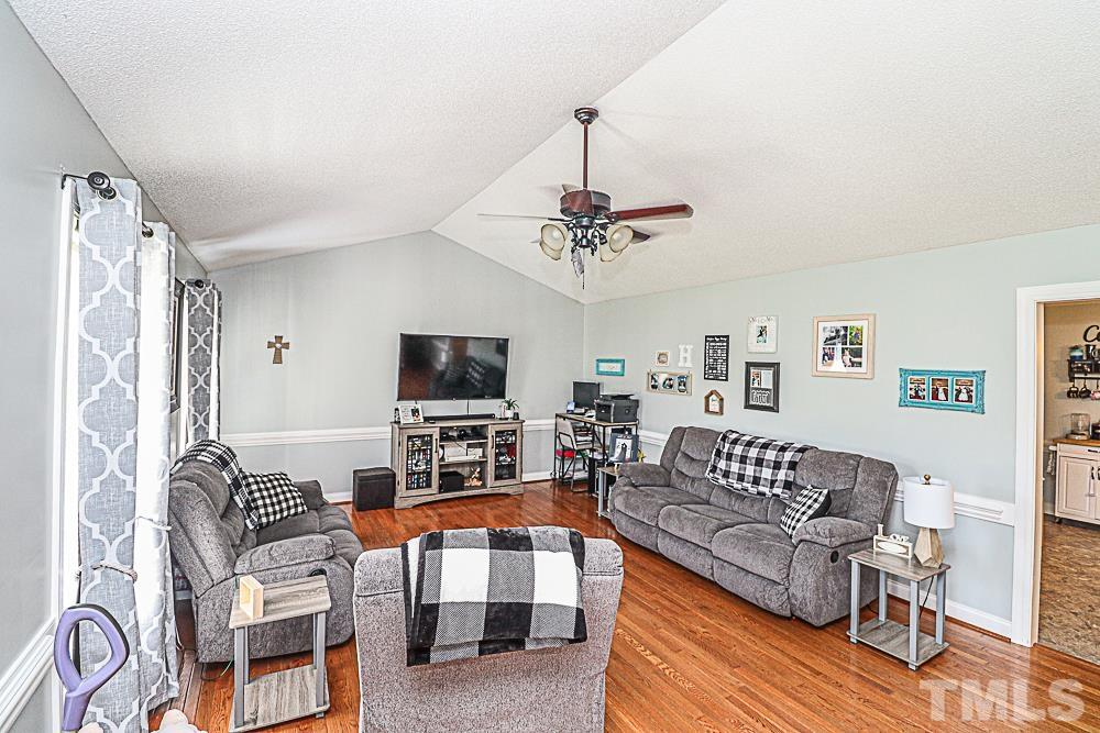 10325 Chestnut Ridge Road Bailey, NC 27807 - Photo 9 of 23 a living room with furniture and a flat screen tv