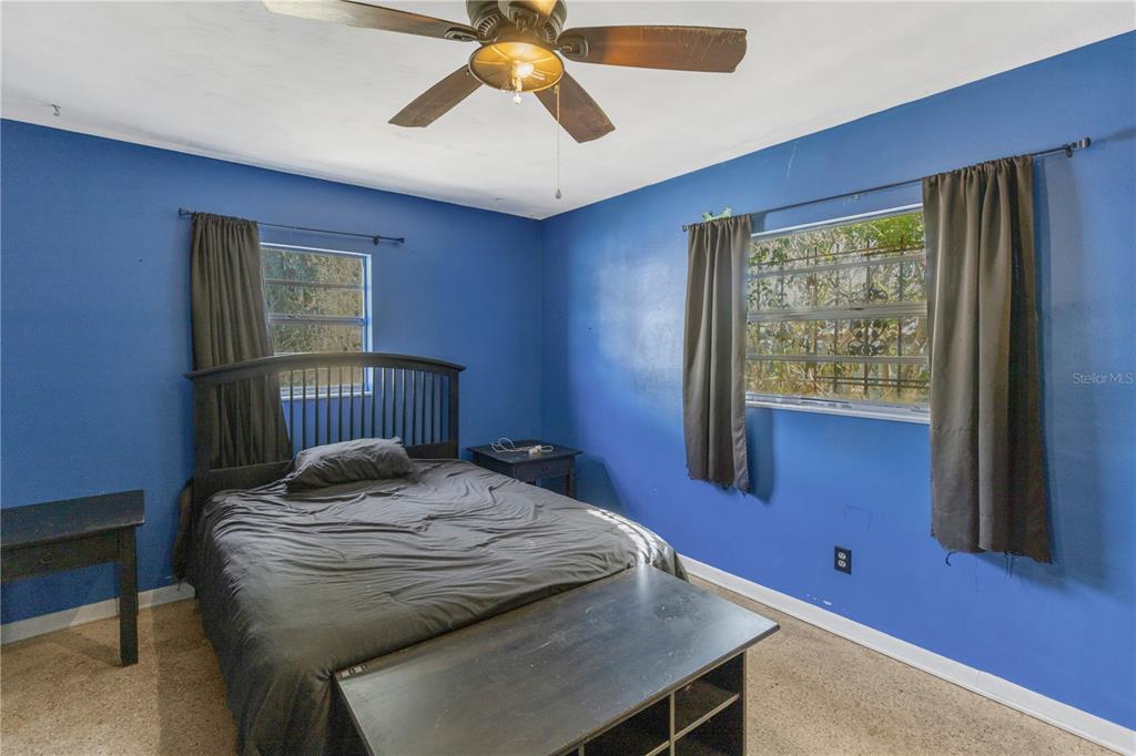 310 Kenmore Road Brandon, FL 33511 - Photo 21 of 33 a bed sitting in a bedroom next to a window