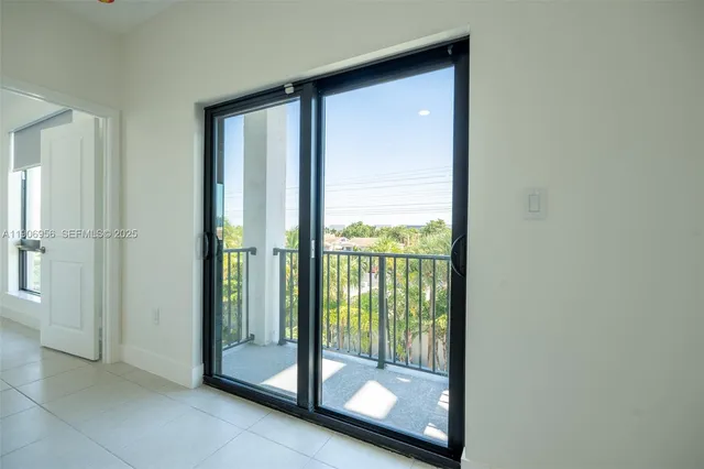 a view of a bathroom with a glass door