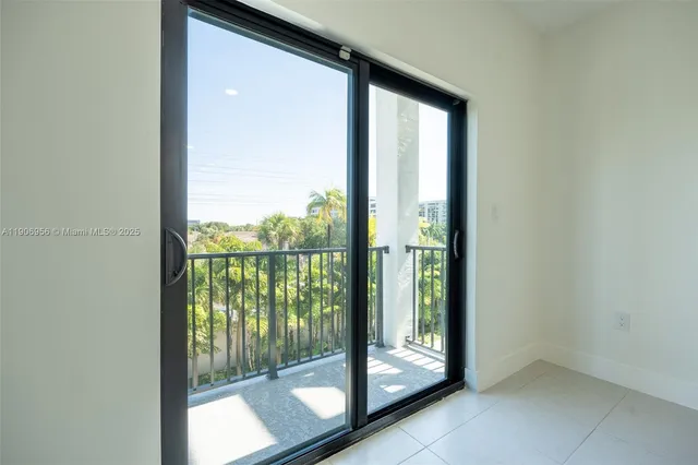 a view of a room that has a large window