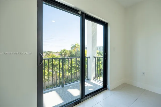 a view of a room that has a large window