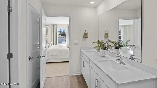 a bathroom with a sink and mirror