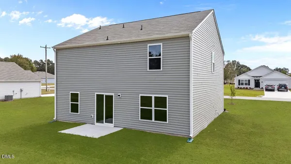 a view of a house with a backyard
