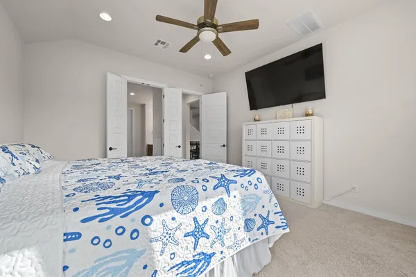 a spacious bathroom with a double vanity sink a large mirror and a shower