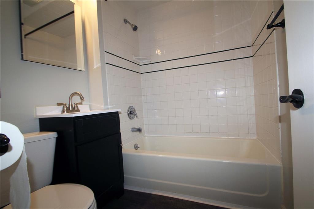 229 Edmond Street Pittsburgh, PA 15224 - Photo 14 of 22 a bathroom with a sink toilet and shower