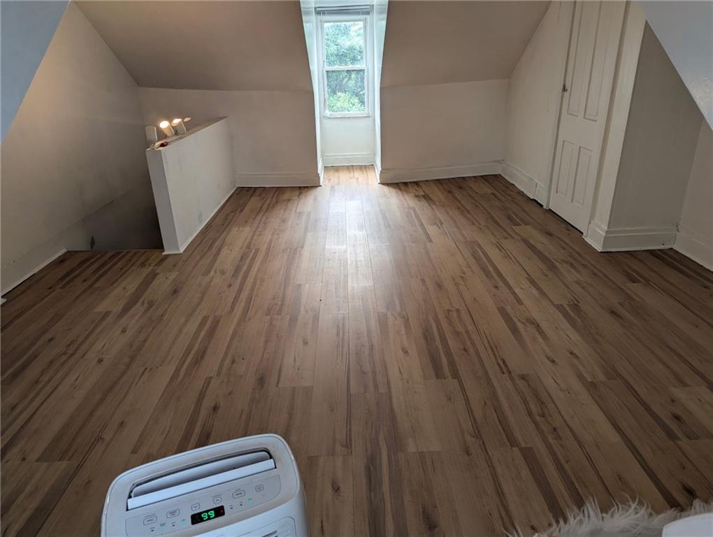 229 Edmond Street Pittsburgh, PA 15224 - Photo 19 of 22 a view of hallway with wooden floor