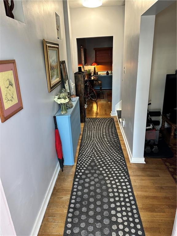 229 Edmond Street Pittsburgh, PA 15224 - Photo 3 of 22 a view of a hallway with wooden floor and furniture