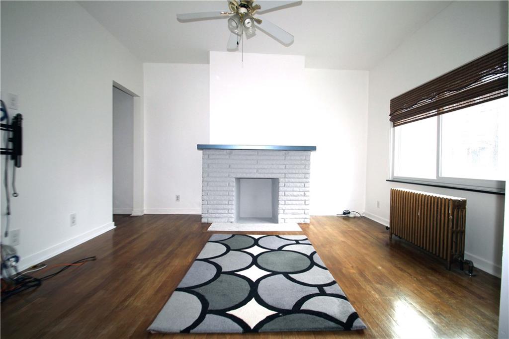 229 Edmond Street Pittsburgh, PA 15224 - Photo 6 of 22 a bedroom with a bed and a window