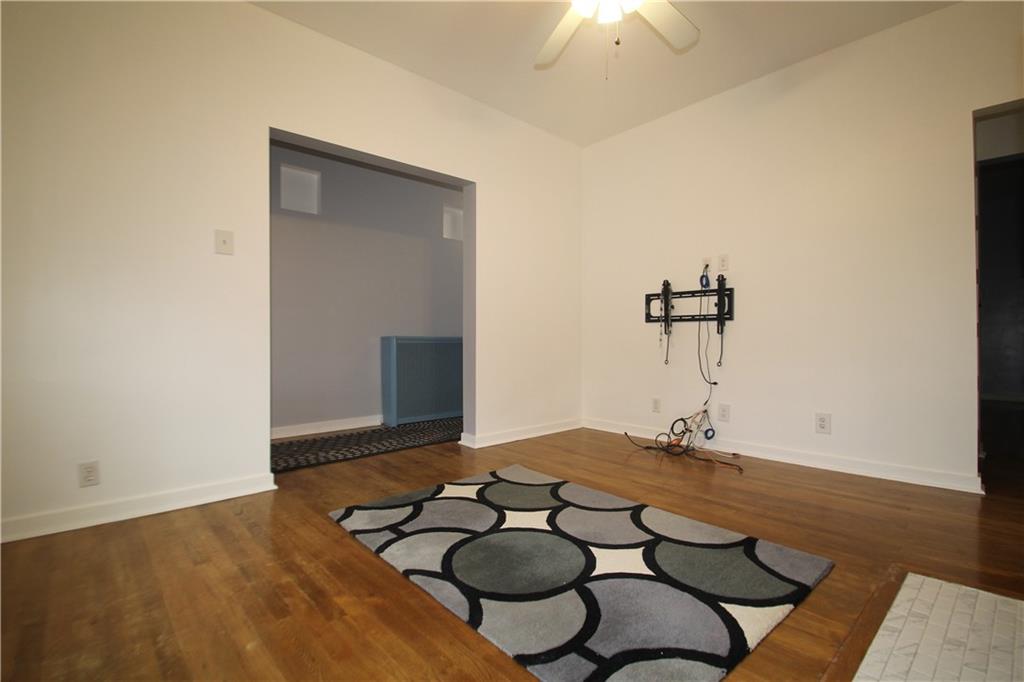 229 Edmond Street Pittsburgh, PA 15224 - Photo 9 of 22 a view of a room with a table and wooden floor