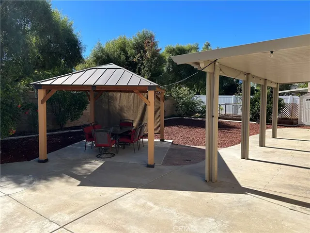 a view of backyard with sitting area