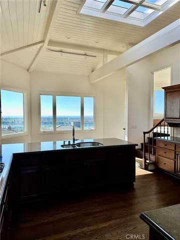 a kitchen with a sink and stove