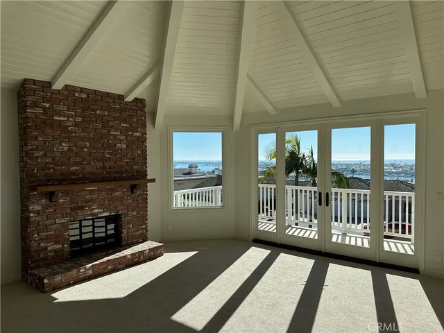 a view of a porch with wooden floor and fence