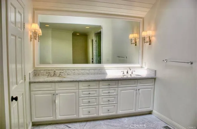 a bathroom with a shower and a sink