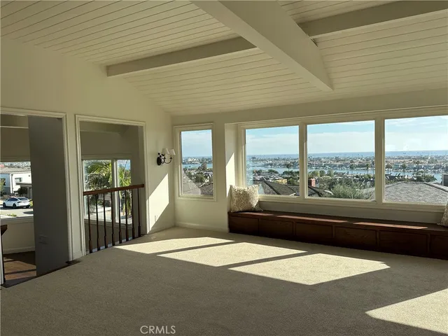a living room with a large window and a table