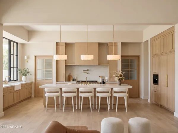 a very nice looking living room with a large window and kitchen view