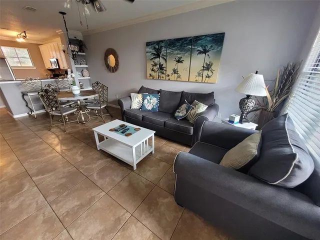a living room with furniture and a clock