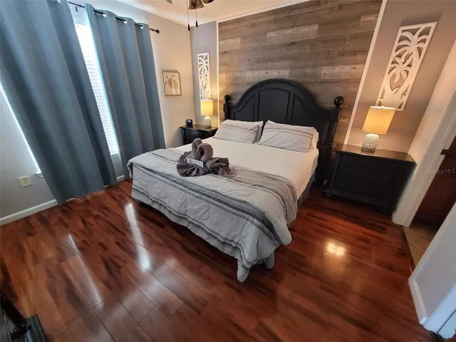 a bedroom with a bed and window