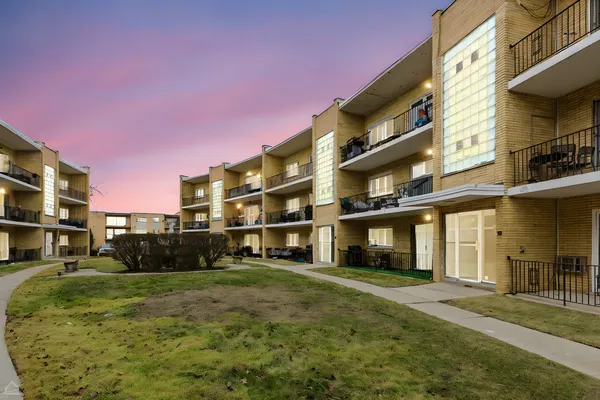 a view of a building with a yard