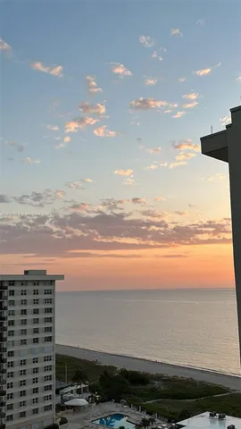 a view of city with ocean