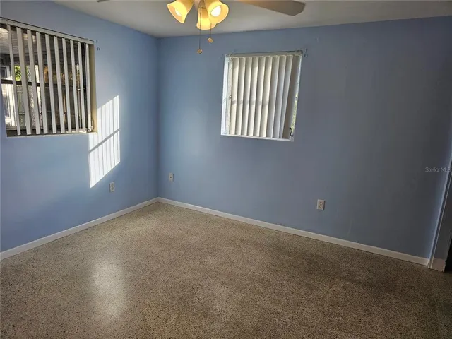 an empty room with windows