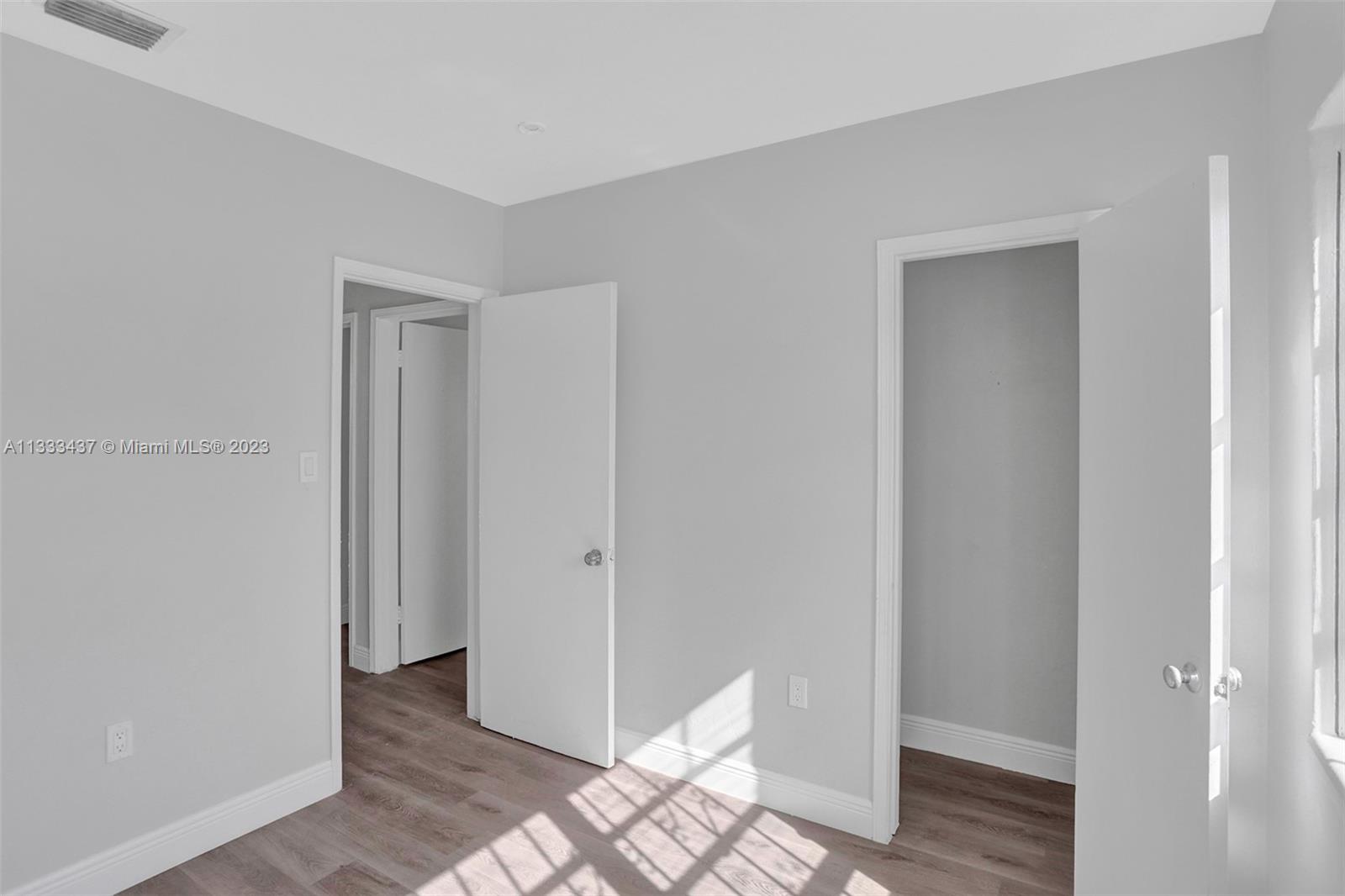 1101 Northwest 147th Street Miami, FL 33168 - Photo 16 of 45 a view of a bathroom with wooden floor