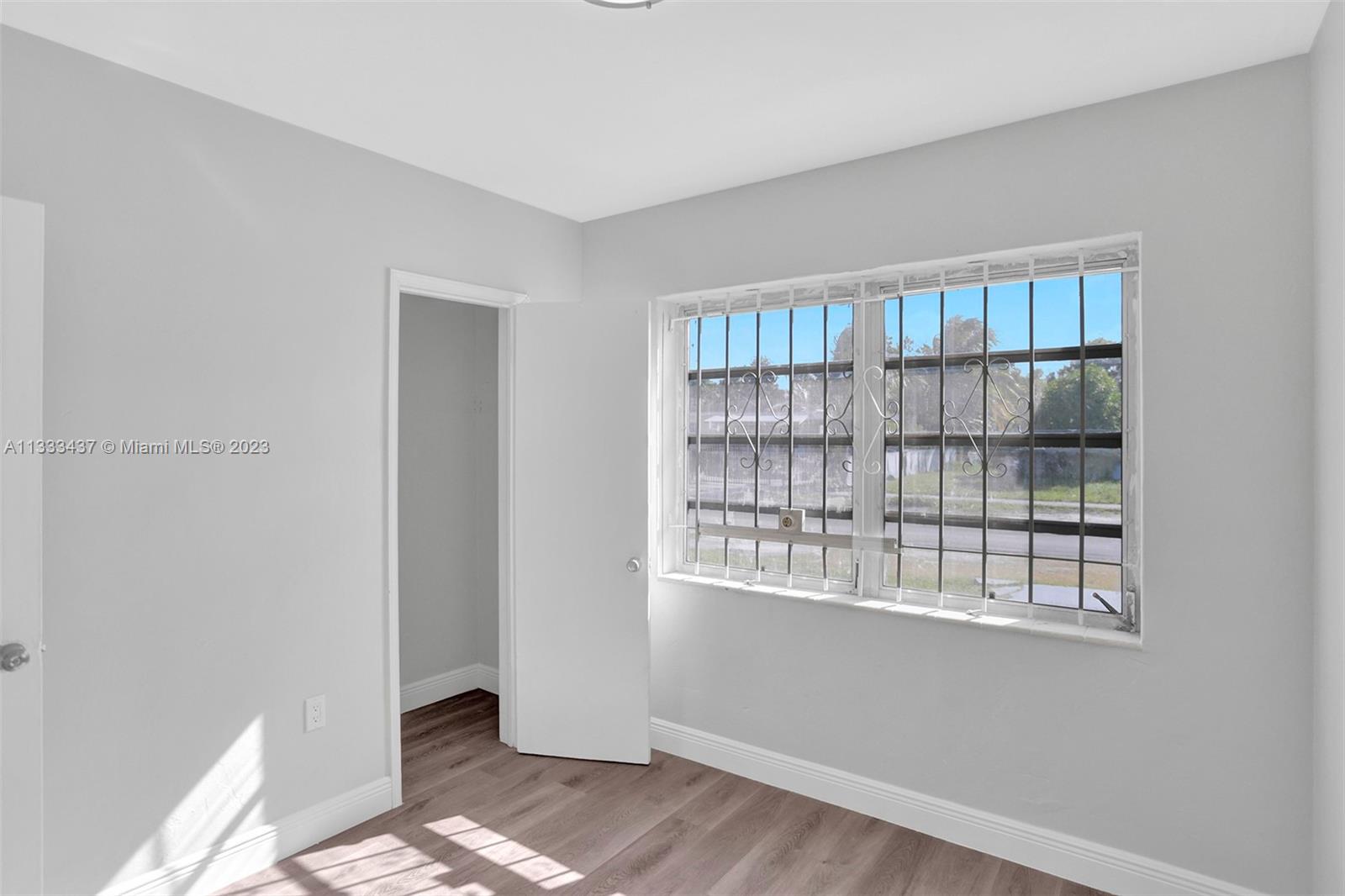1101 Northwest 147th Street Miami, FL 33168 - Photo 17 of 45 a view of an empty room with a window