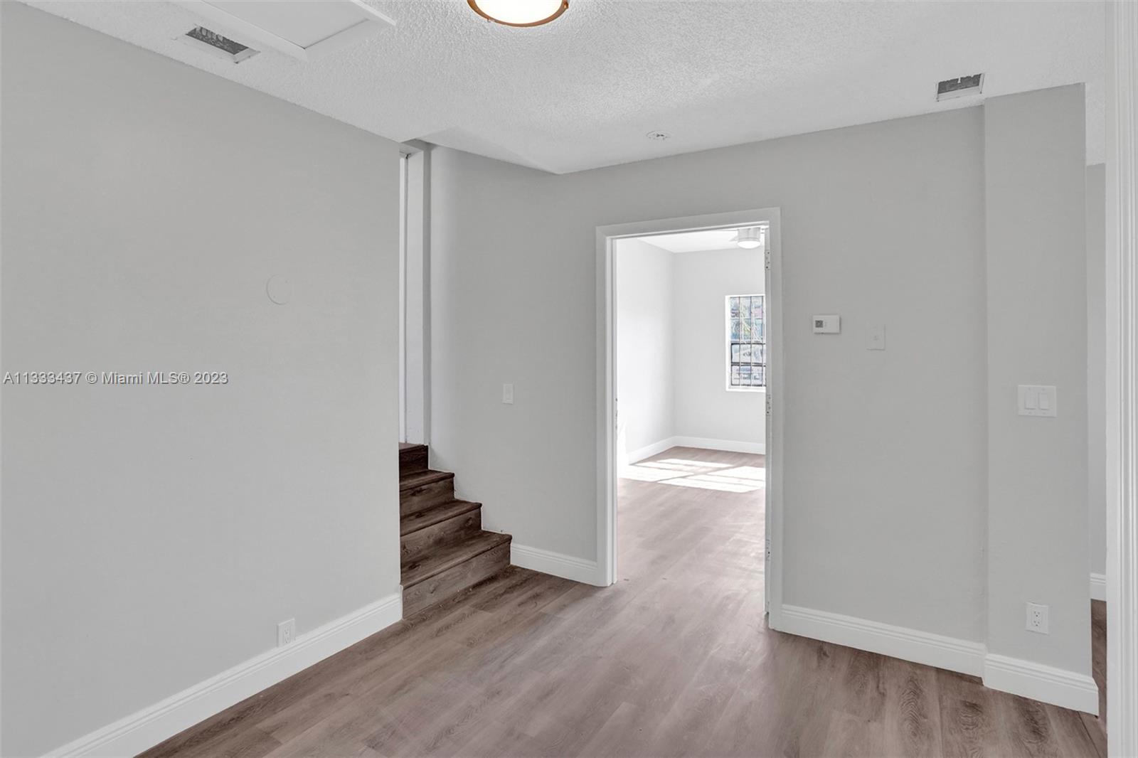 1101 Northwest 147th Street Miami, FL 33168 - Photo 28 of 45 wooden floor in an empty room