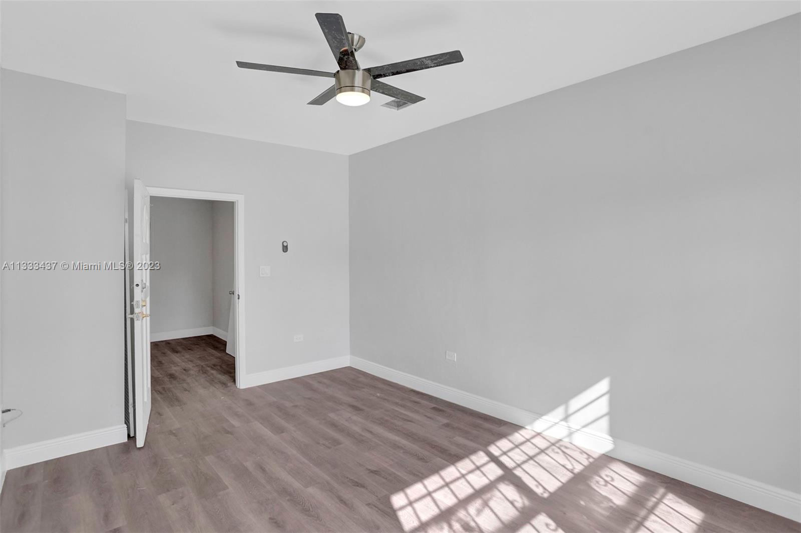 1101 Northwest 147th Street Miami, FL 33168 - Photo 37 of 45 a view of an empty room and wooden floor