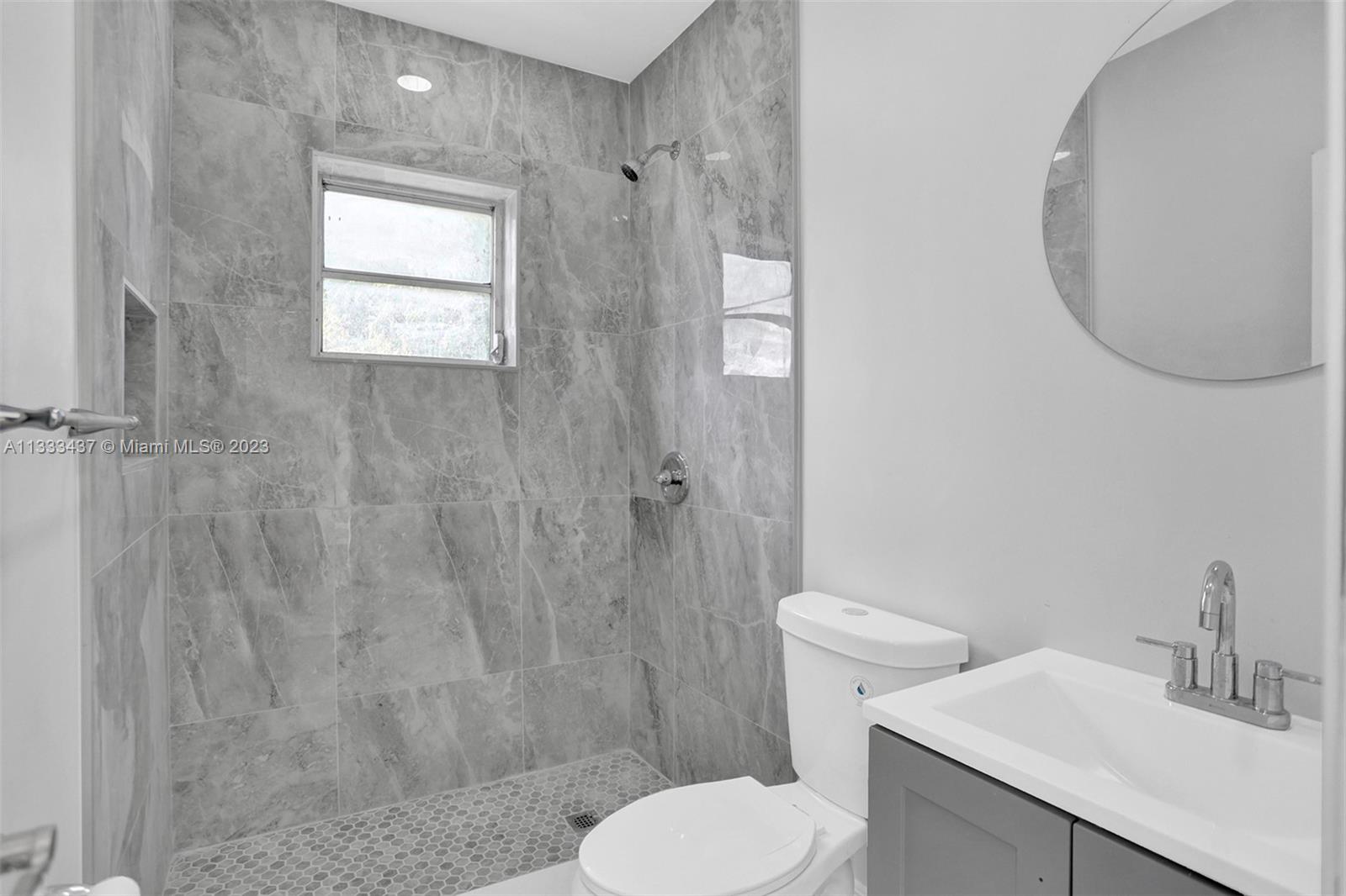1101 Northwest 147th Street Miami, FL 33168 - Photo 38 of 45 a bathroom with a sink toilet and shower