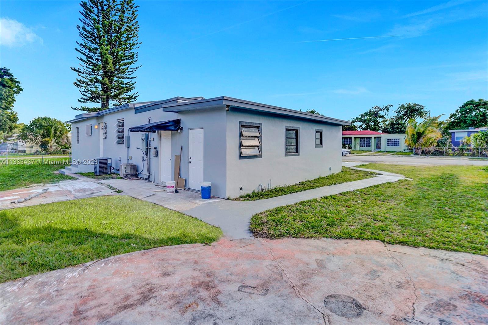 1101 Northwest 147th Street Miami, FL 33168 - Photo 41 of 45 a house view with a garden space