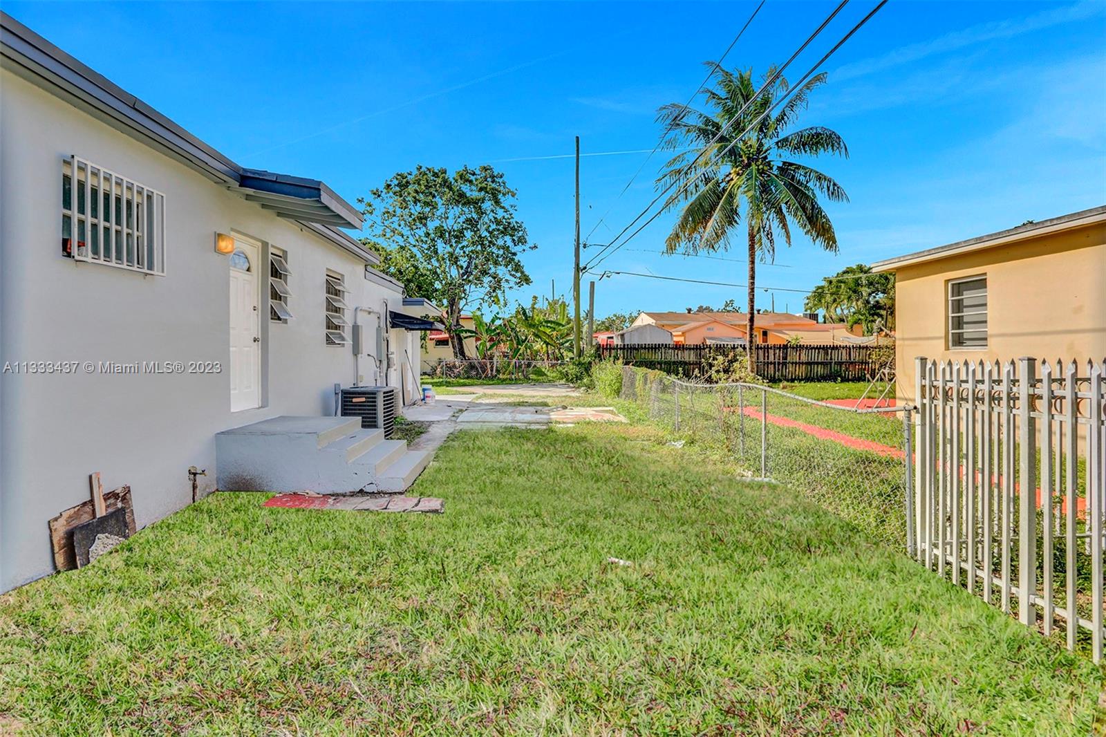 1101 Northwest 147th Street Miami, FL 33168 - Photo 43 of 45 a backyard of a house with seating space