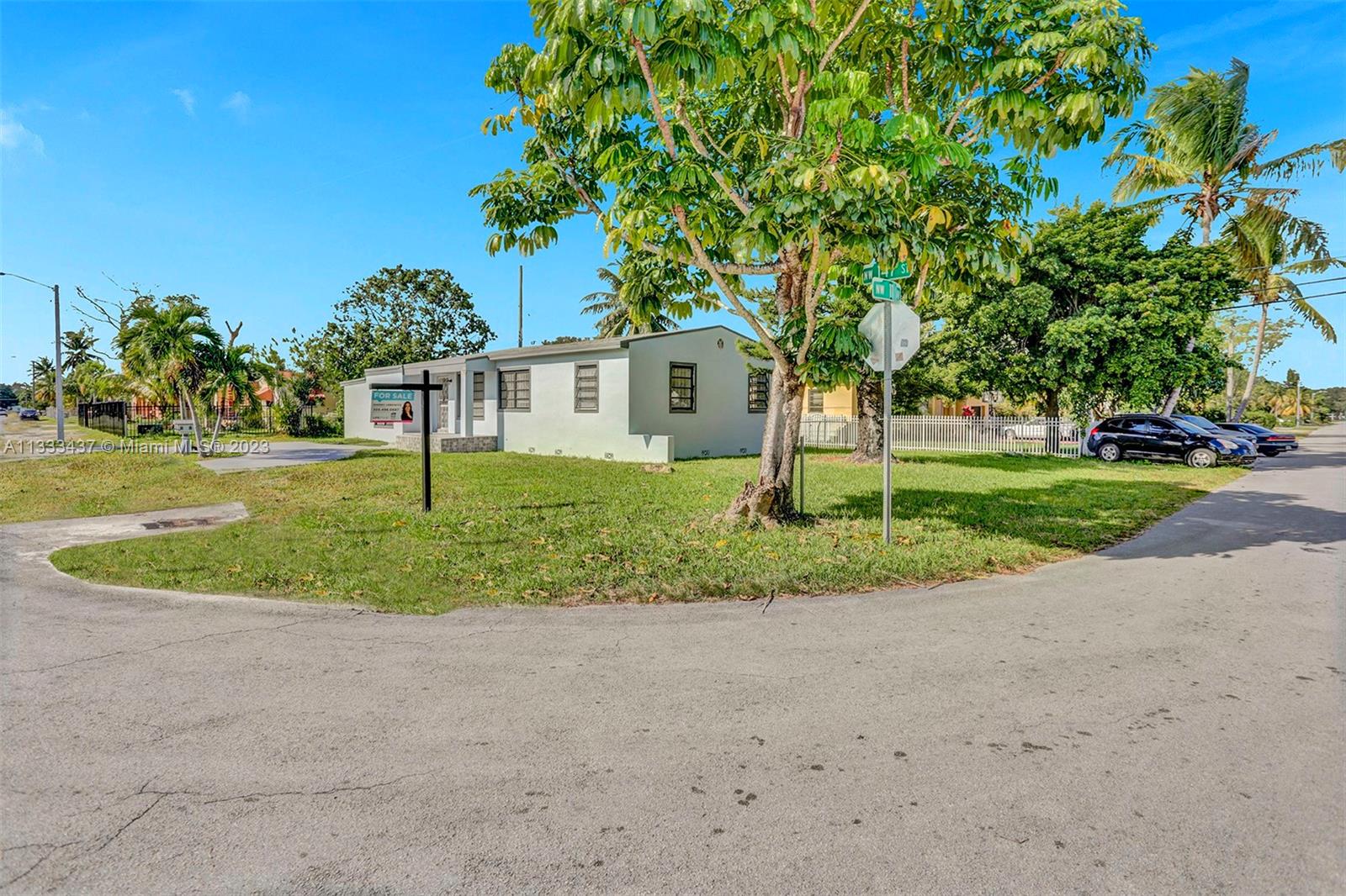 1101 Northwest 147th Street Miami, FL 33168 - Photo 44 of 45 a front view of a house with a yard